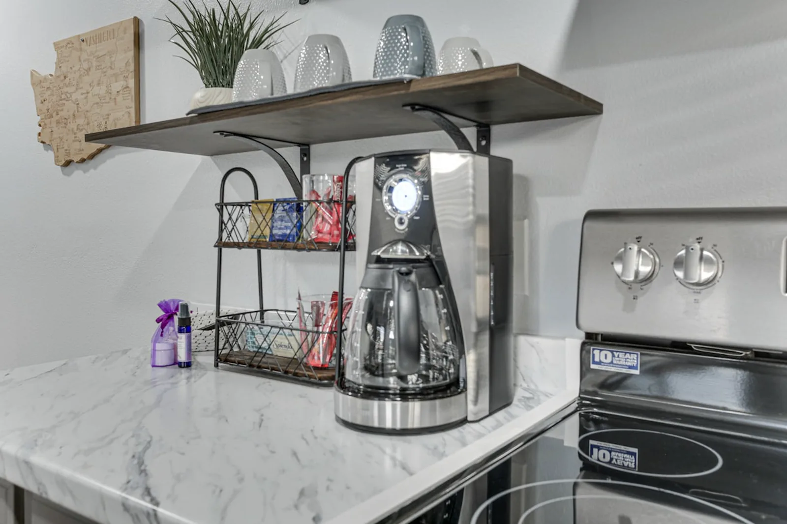 Kitchen detail — custom open shelving and new counters